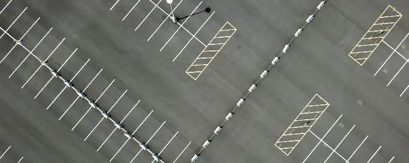 aerial view of clear striping of a parking lot.webp