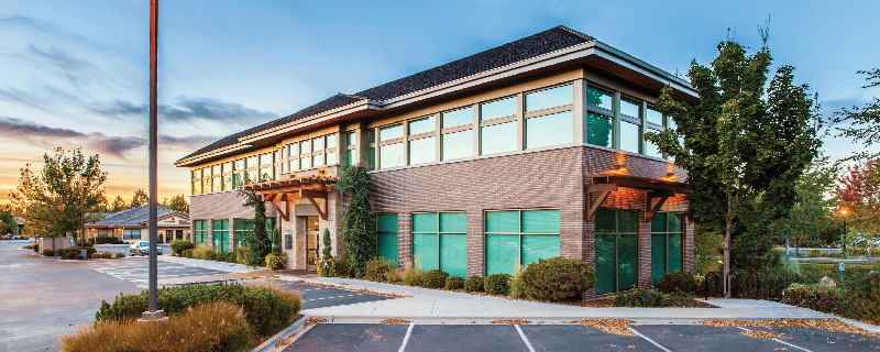 commercial building with striped parking spaces